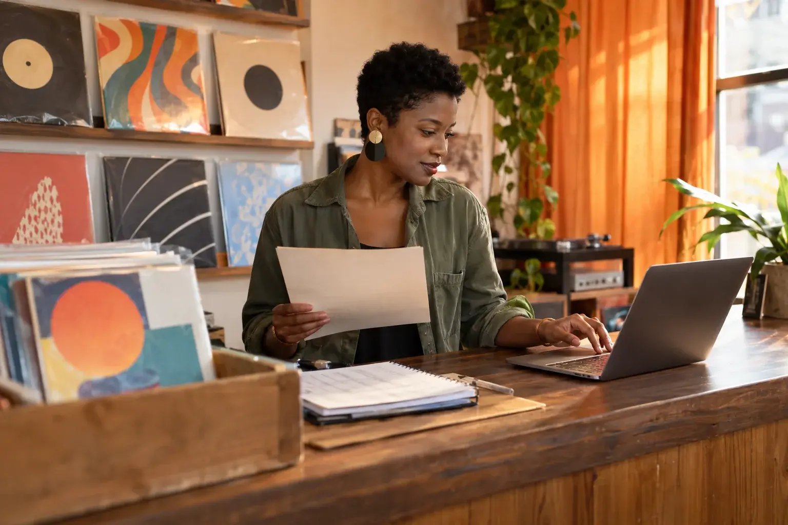 A record-shop owner brings sales information into her order workflow.