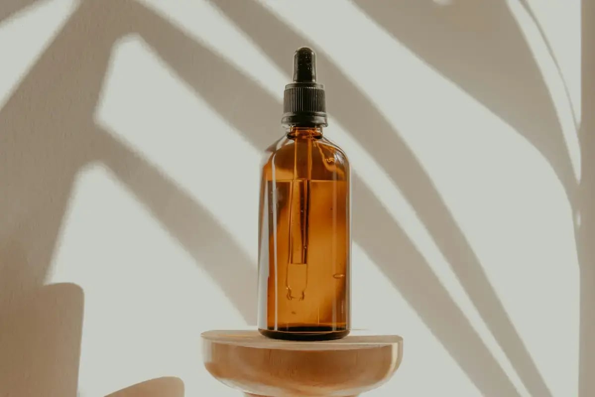 Skincare bottle displayed in warm natural light
