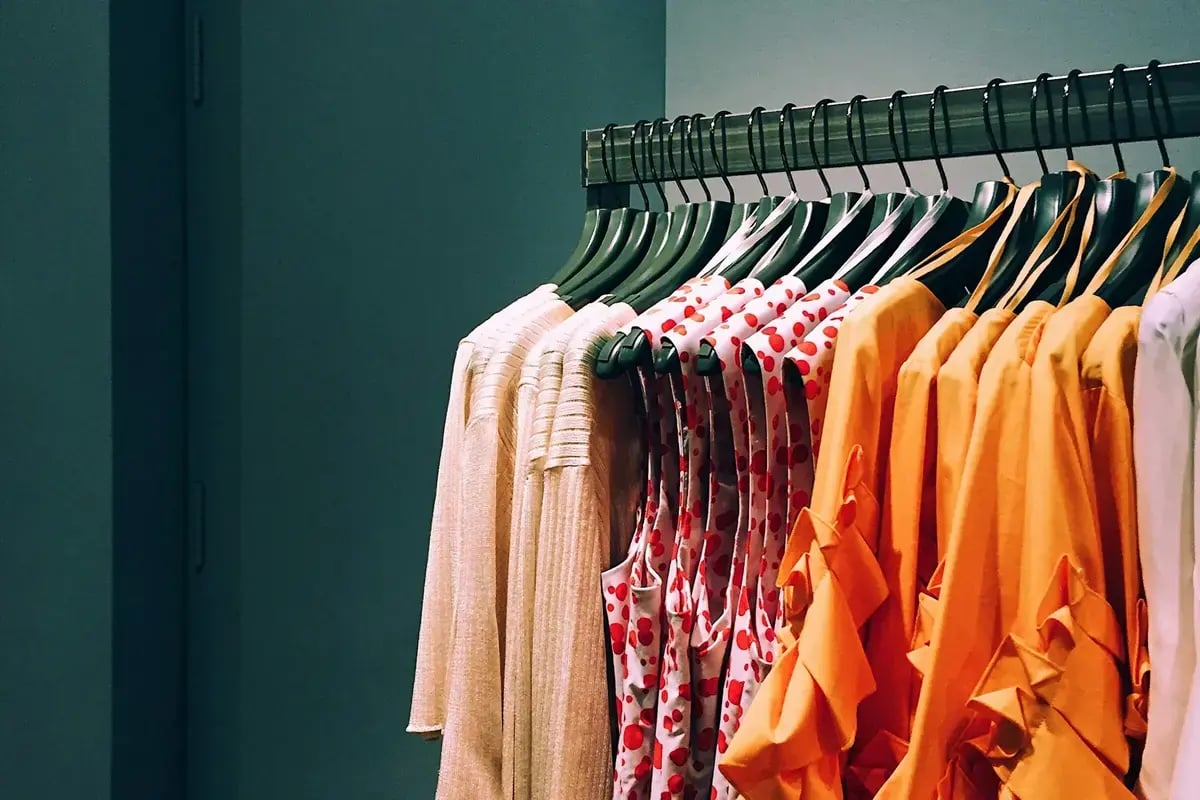 Colourful apparel on a retail rack ready for online orders